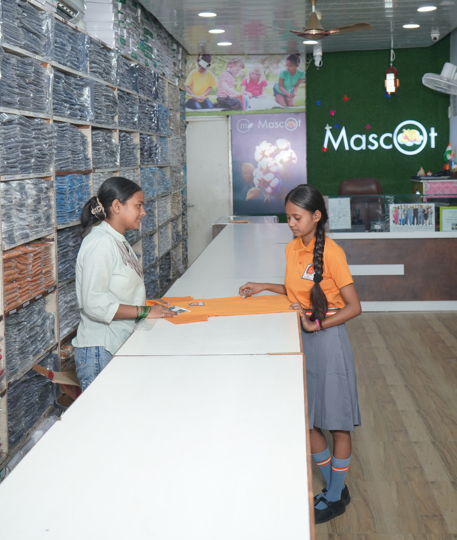 A pupil at the Sector 35 counter, a shirt unfolded on the top