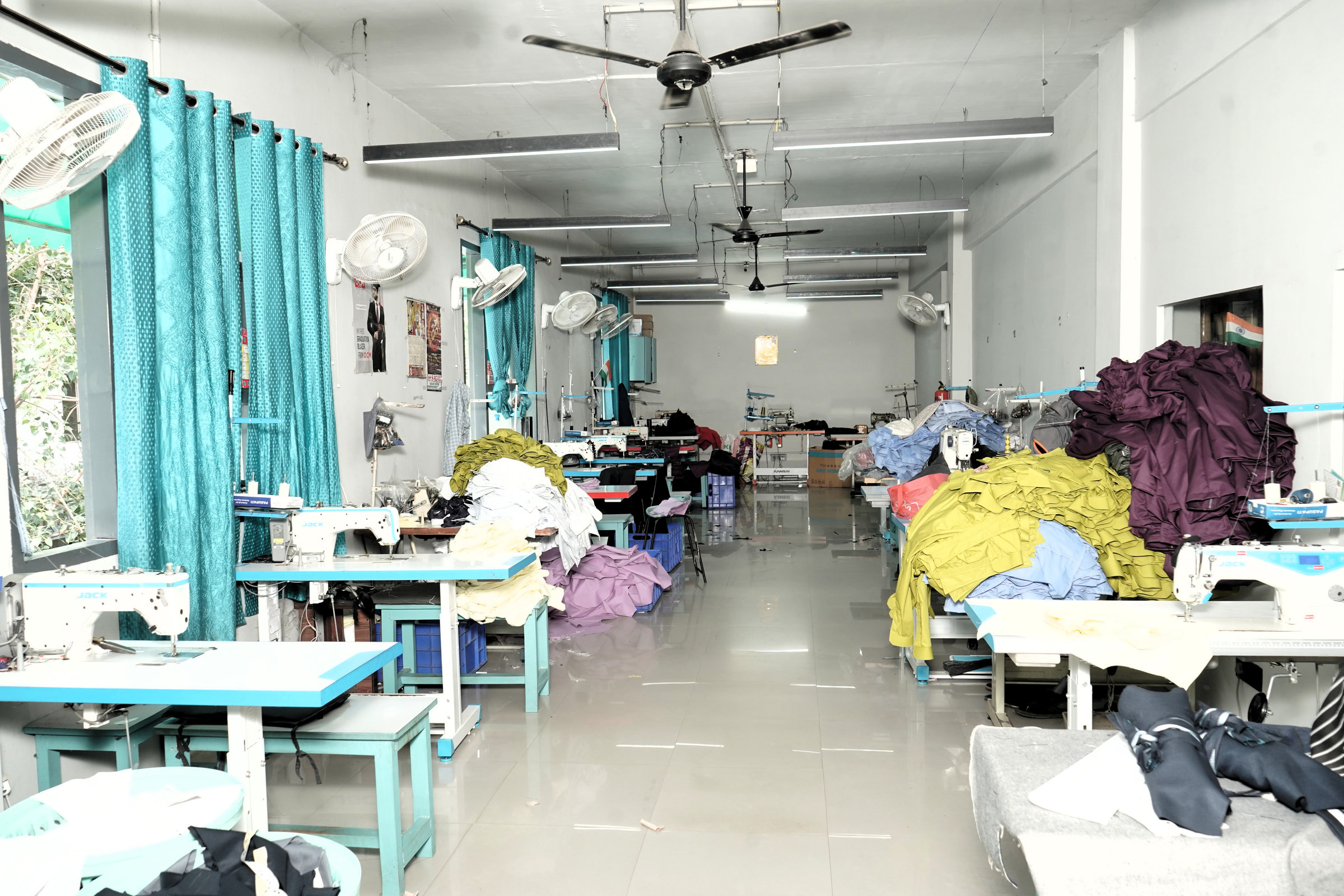 The stitching floor behind the office, machine by machine