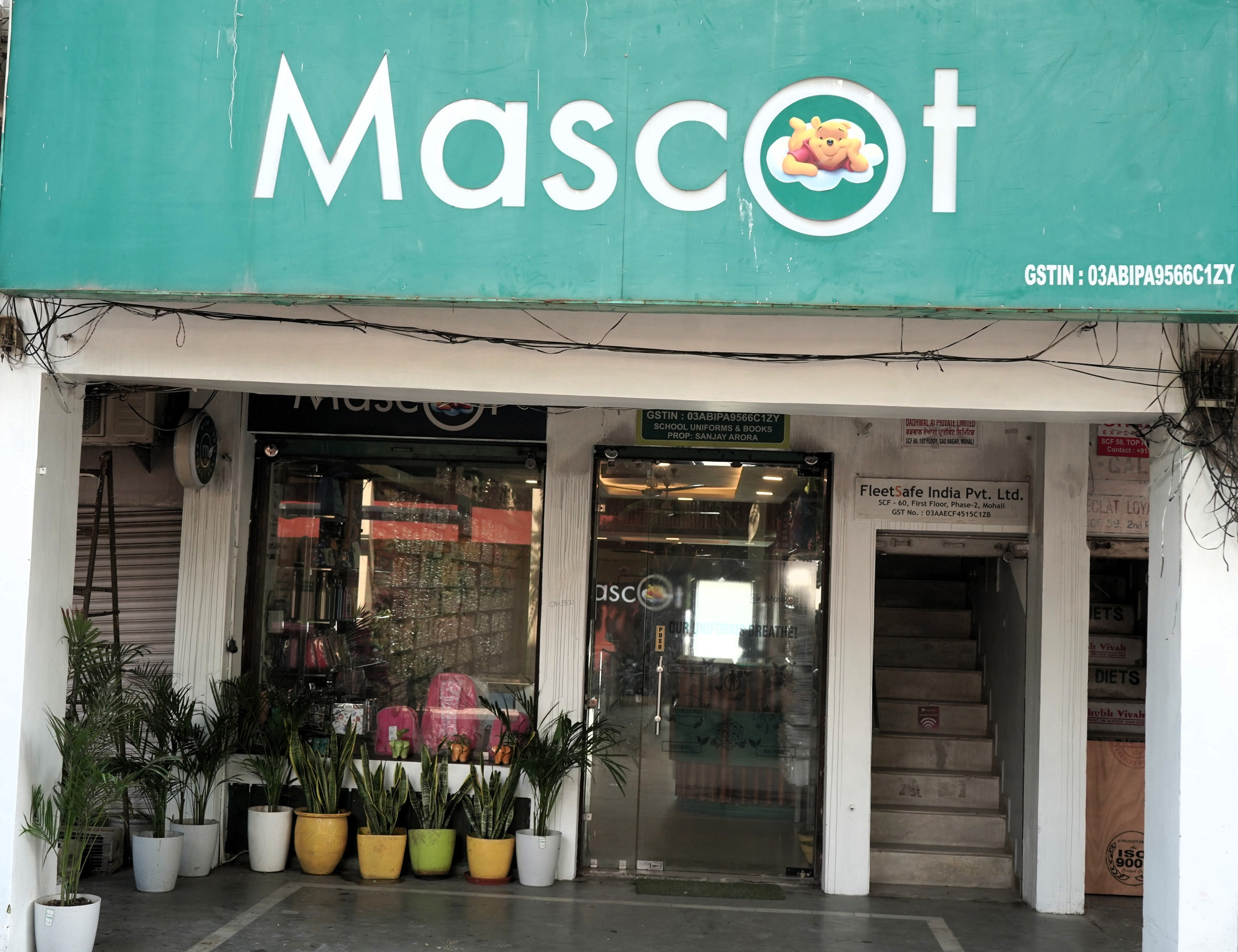 The Mohali shop from the street, plants along the step under the Mascot fascia