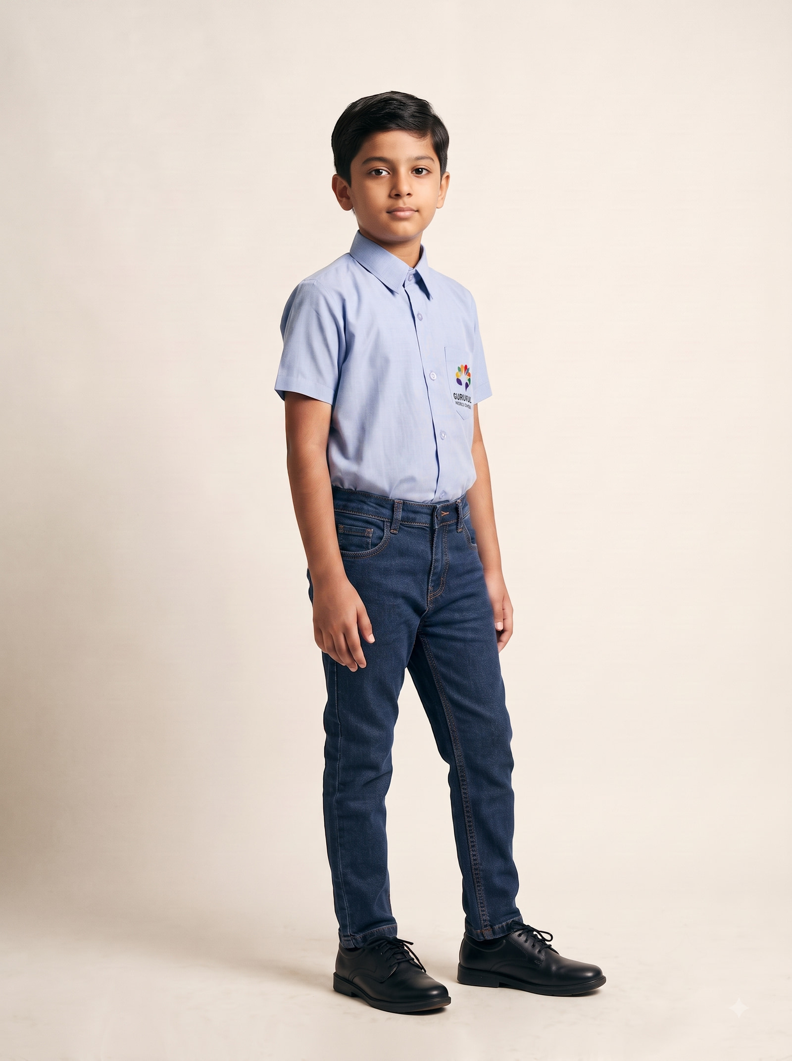 Pale blue shirting over indigo cloth, with the crest embroidered at the chest.